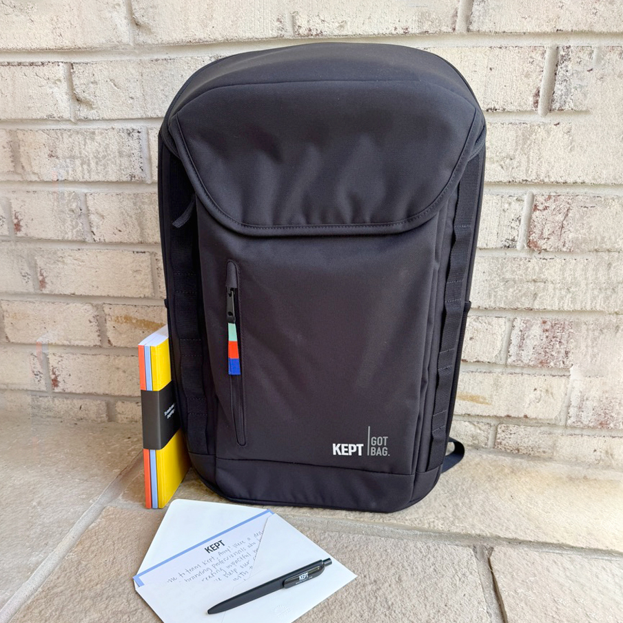 Company swag for new employees with GOT bag backpack, pen, notebook, and personalized insert.