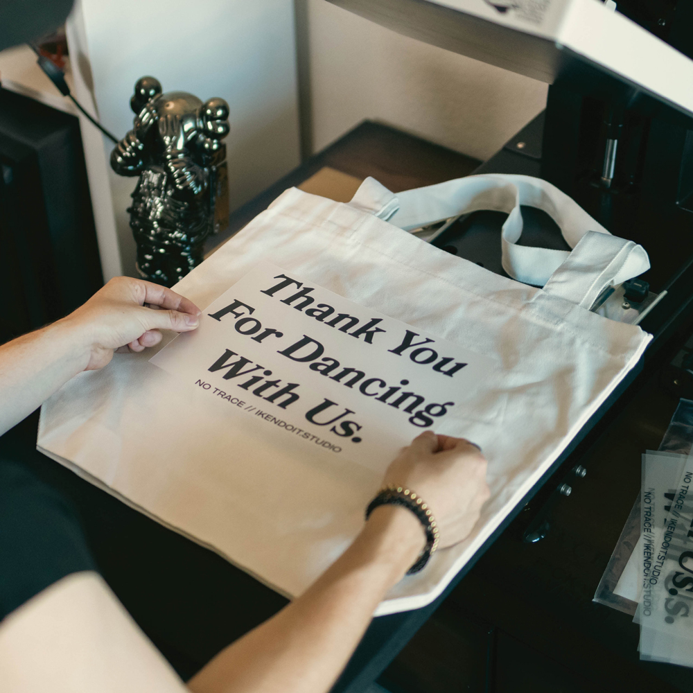 A custom eco-friendly tote bag showing our merchandising services. 
