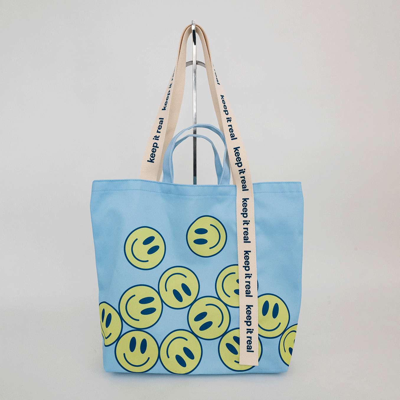 A custom tote bag with modern pattern and custom silkscreen handle. 