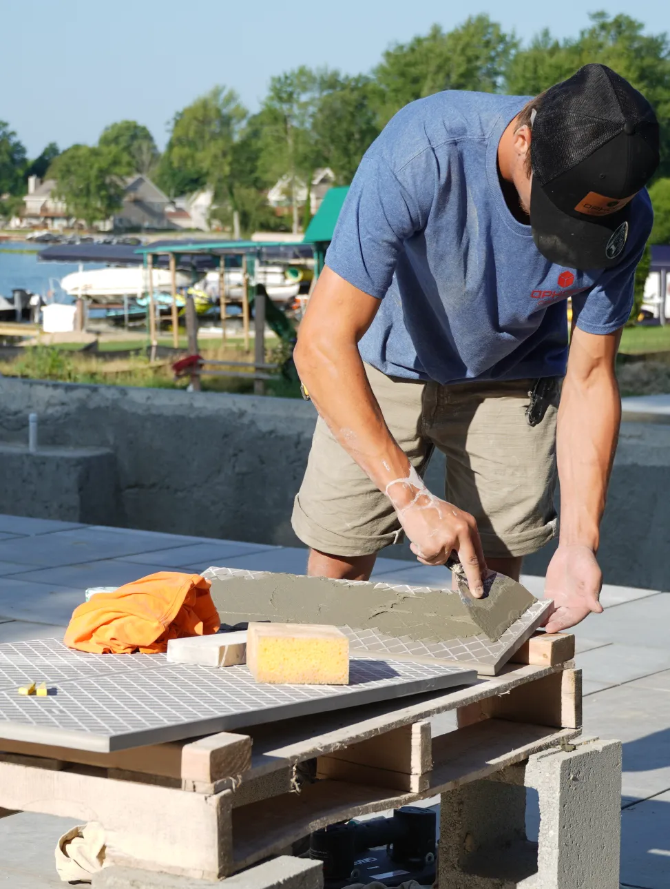 Ophoff Masonry Employee working on a project at a lakefront home