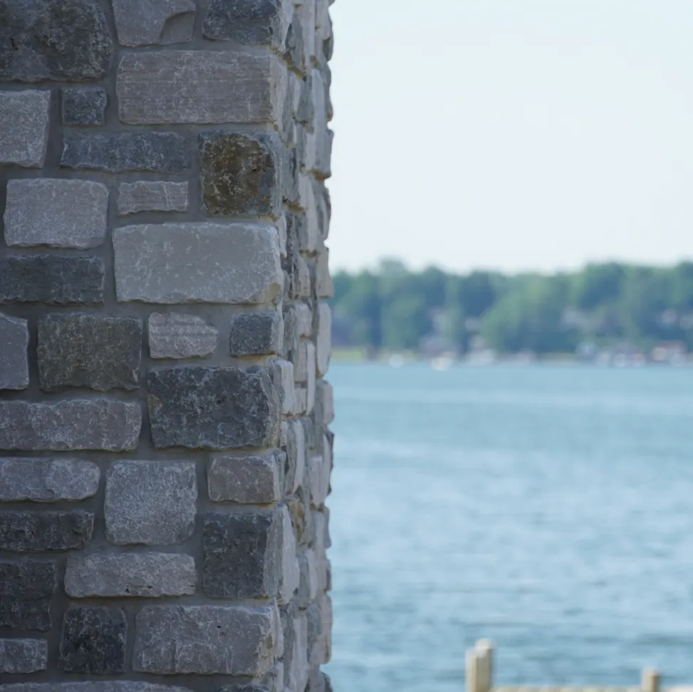 Stone masonry work on an outdoor column at a residential home in michigan