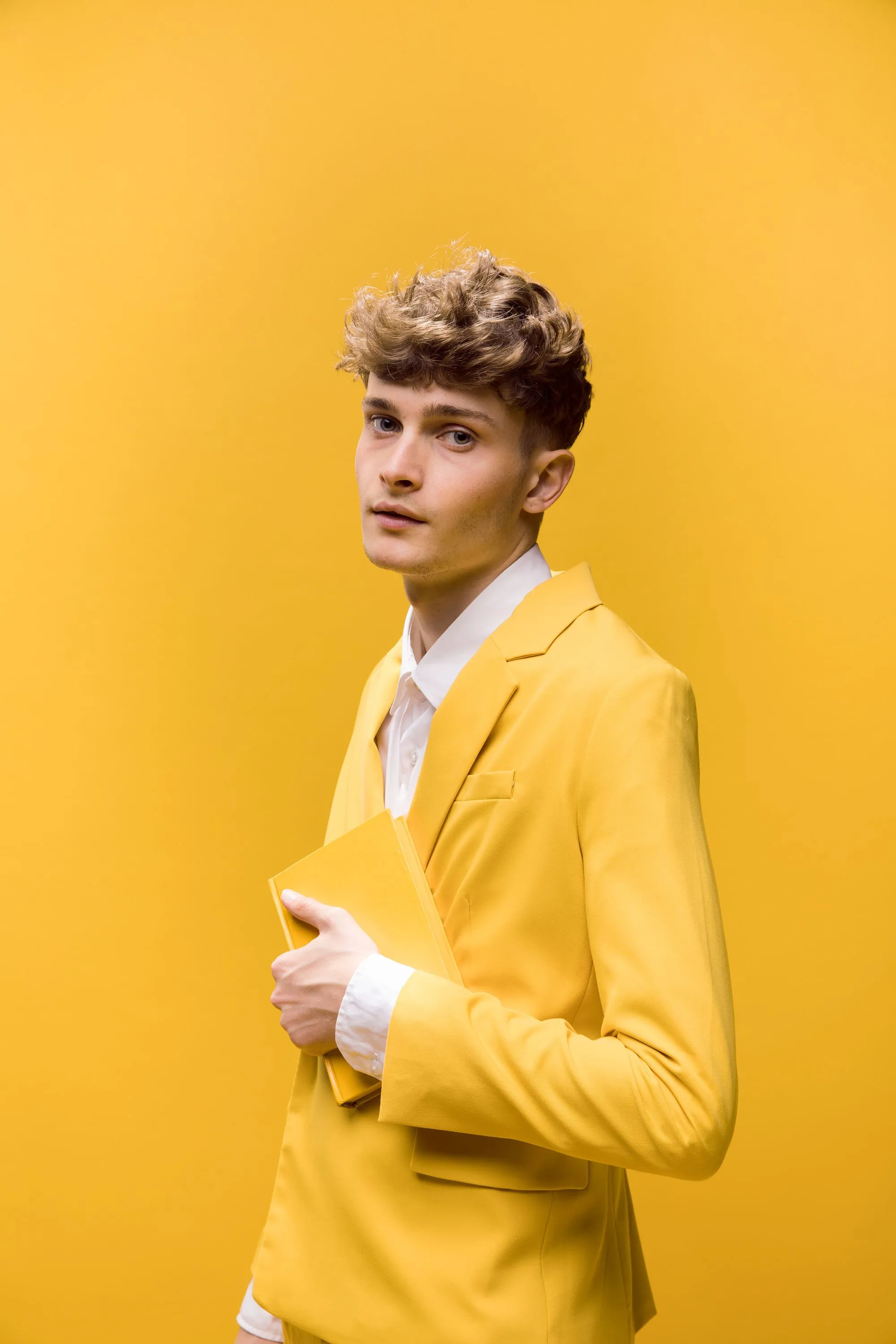 Man in yellow suite on a yellow background