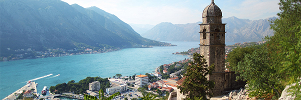 Mountain-lined bay and historic coastal town