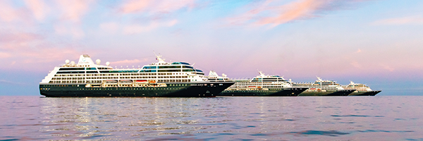 Azamara cruise ships at sea beneath a pastel sky