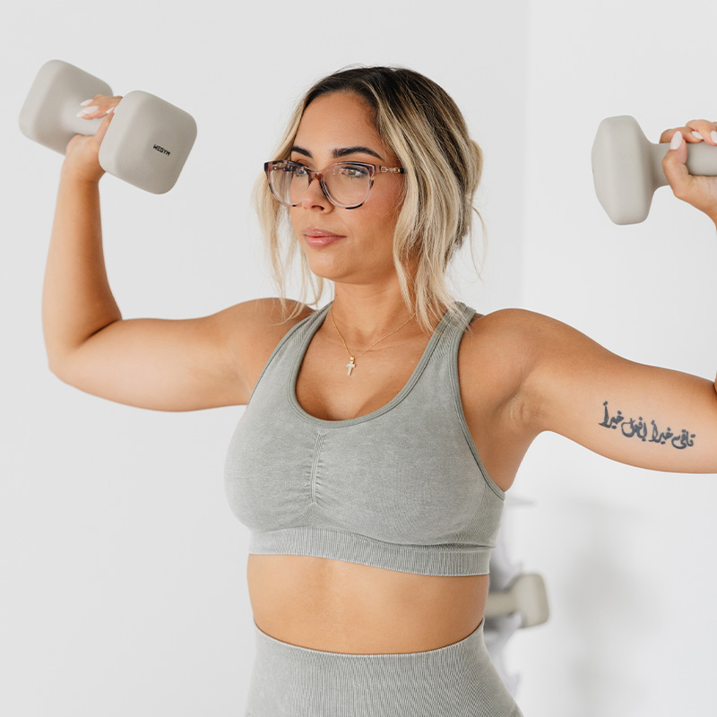 Francesca with dumbbells
