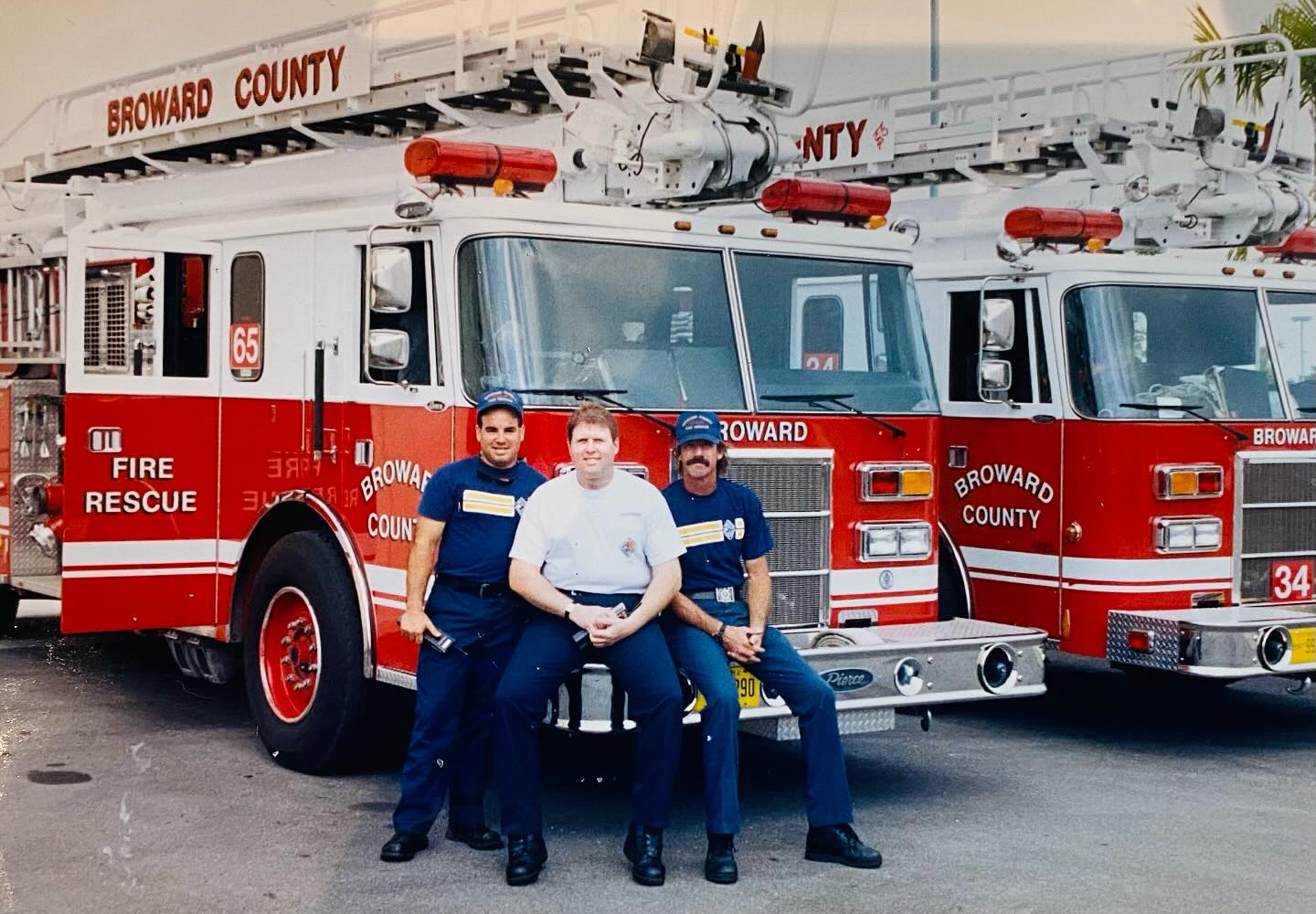 IAFF District 12 members standing with Fire Engine