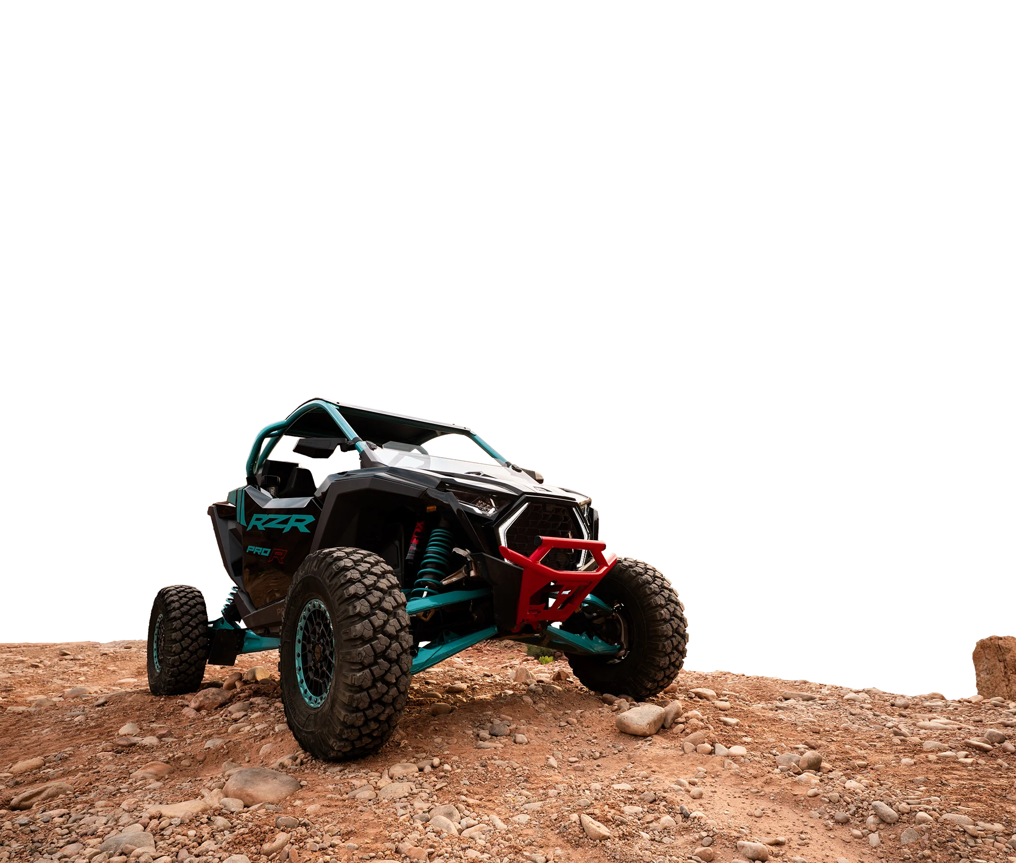 Black and turquoise off-road dune buggy with large rugged tires parked on rocky terrain.
