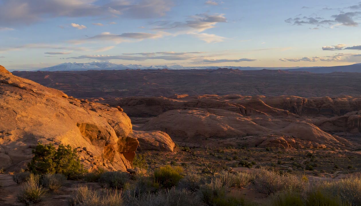 Hell's Revenge overlook glowing in late afternoon light