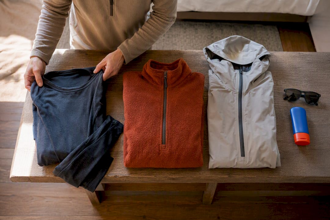 Layered clothing and essentials packed for Moab
