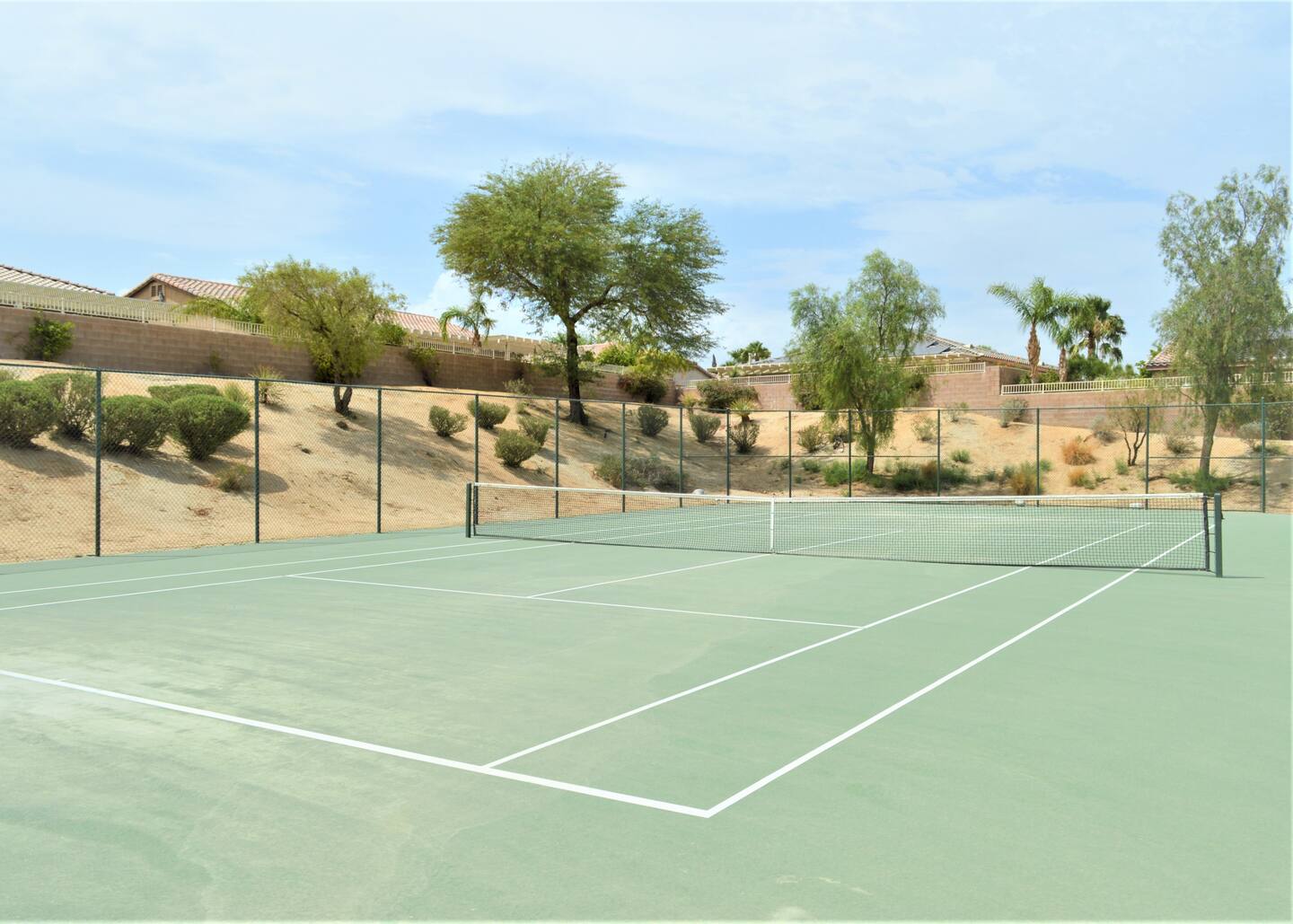 Tennis court with mountain views at palm springs vacation rental