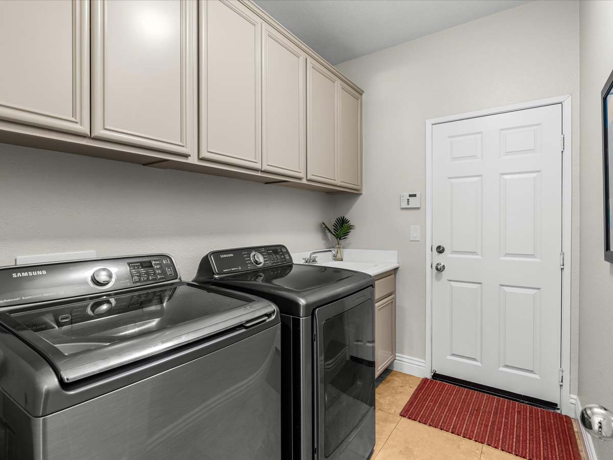 washer and dryer laundry room tropical villa palm springs
