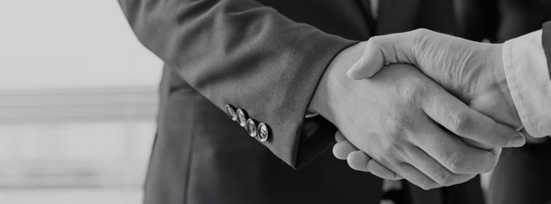 A handshake between two executives