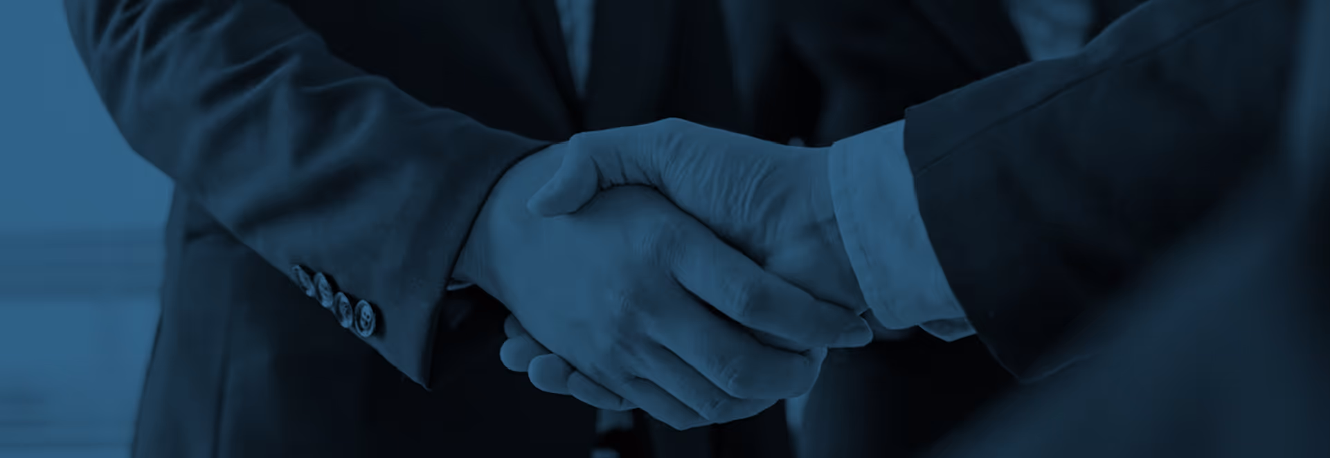A handshake between two executives