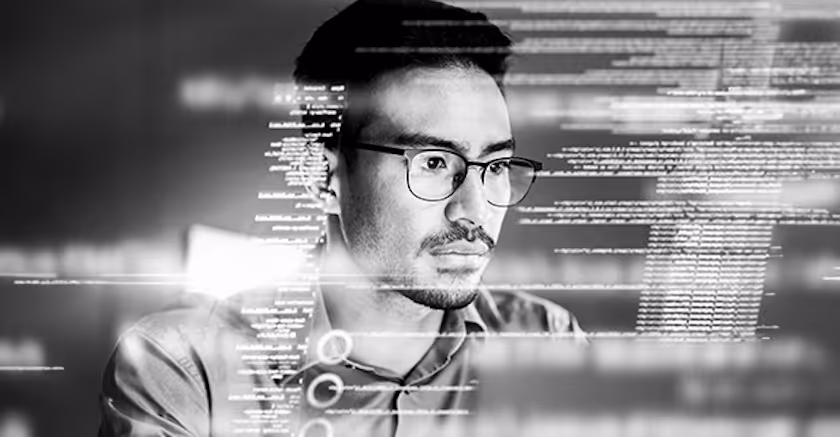 Vervent's staff working with tech codes coming out of his screen