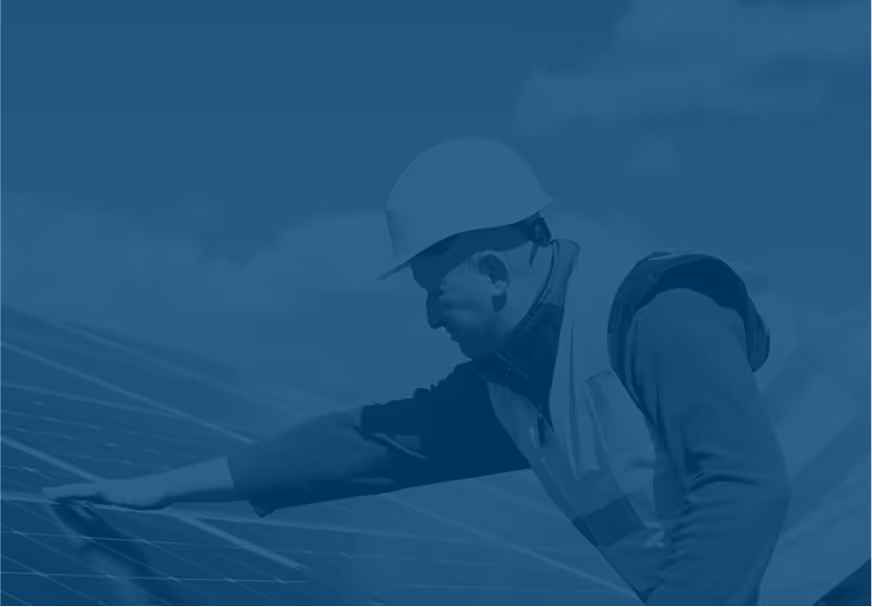 A worker installing a solar panel
