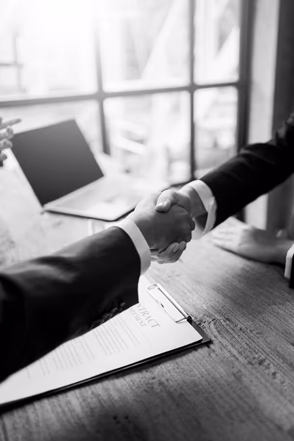 A photo of a handshake sealing a deal