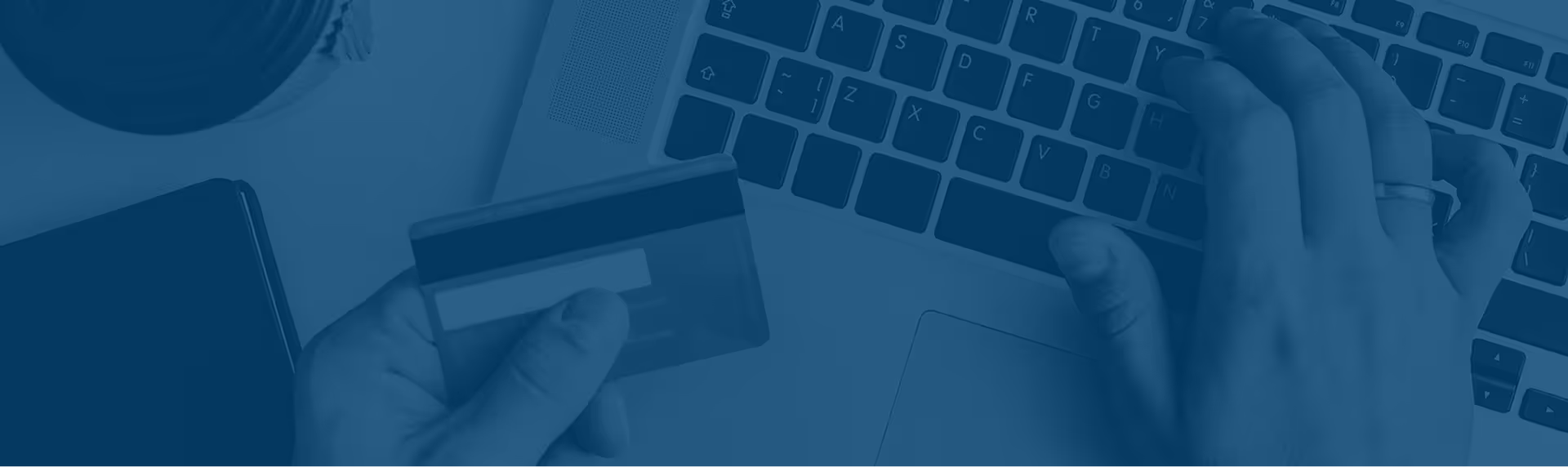 A person using a credit card to buy online