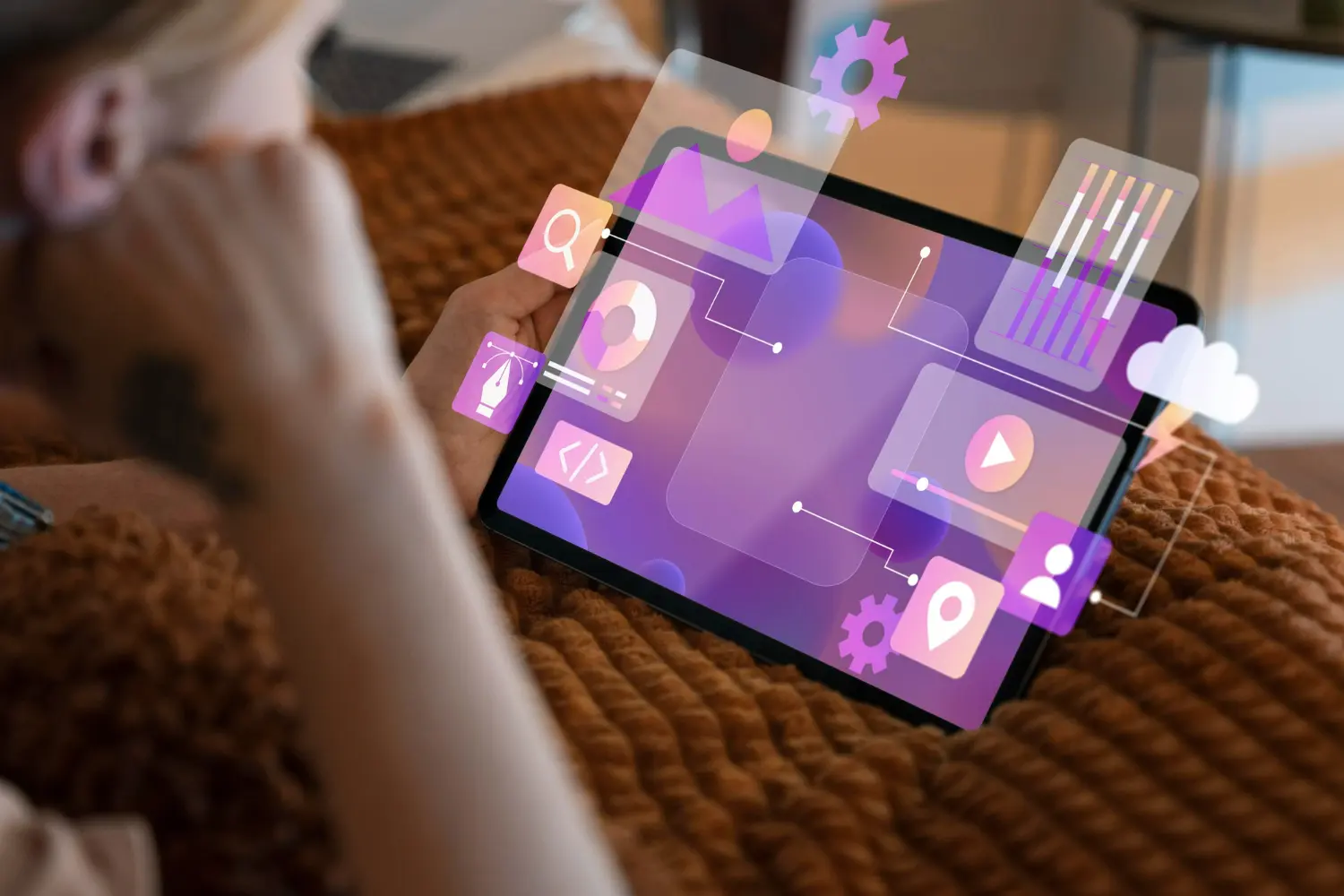 Person holding a tablet with digital marketing and SEO icons floating above the screen, symbolizing data analytics, content creation, and online growth strategies