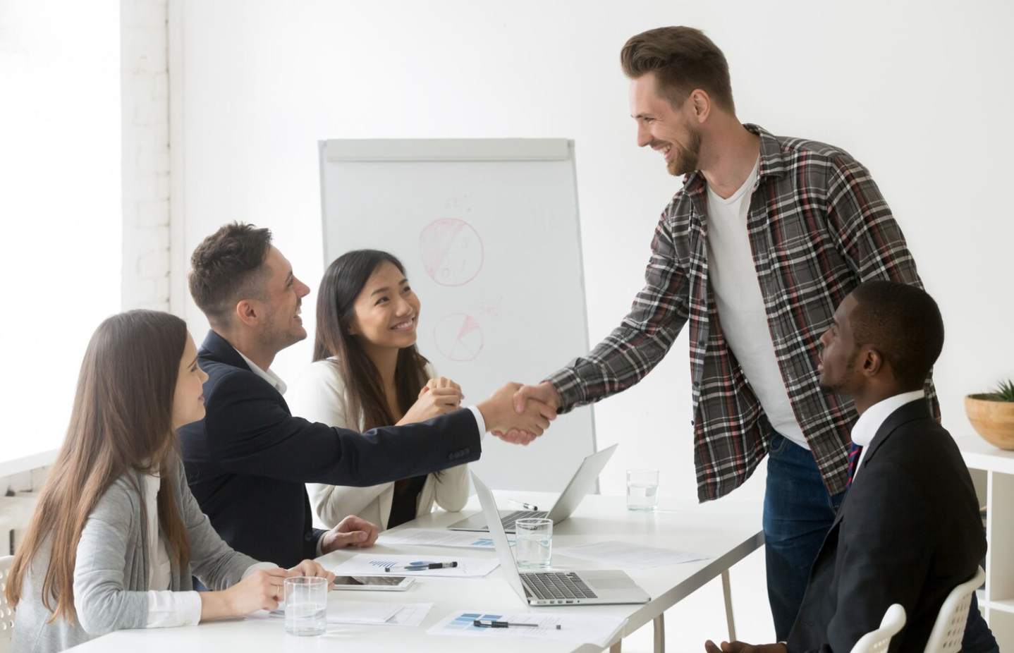 A group meeting in a rehab marketing agency where the leader welcomes a new client