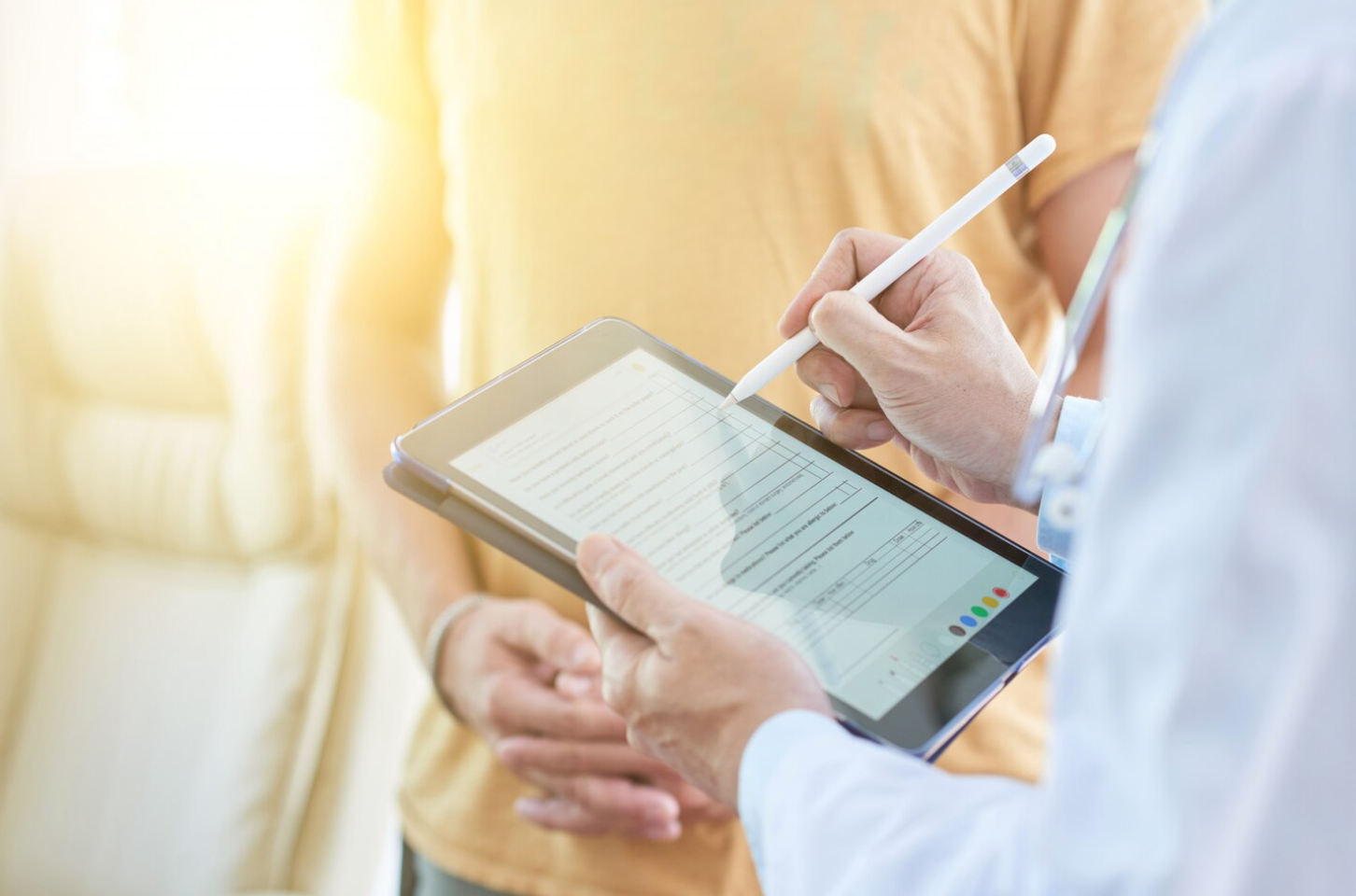 A medical professional handles a patient’s confidential health information, illustrating the types of data that require protection in healthcare marketing