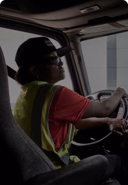 A truck driver in a Standard Logistics truck.