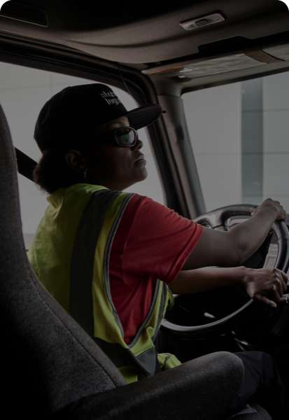 A truck driver in a Standard Logistics truck.