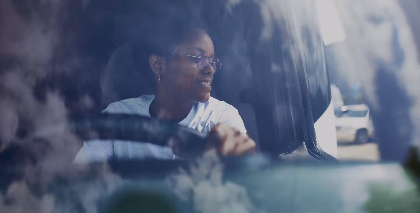 A woman driving a truck.