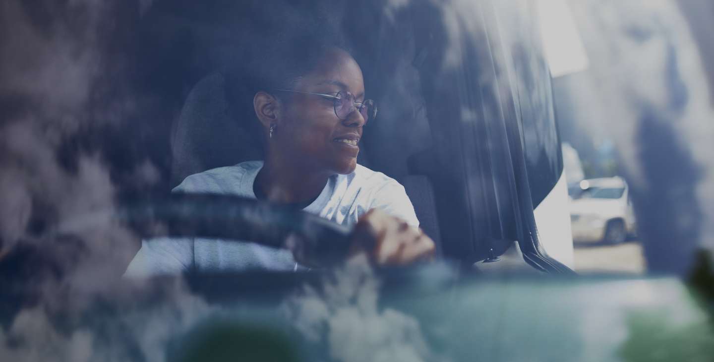 A woman driving a truck.