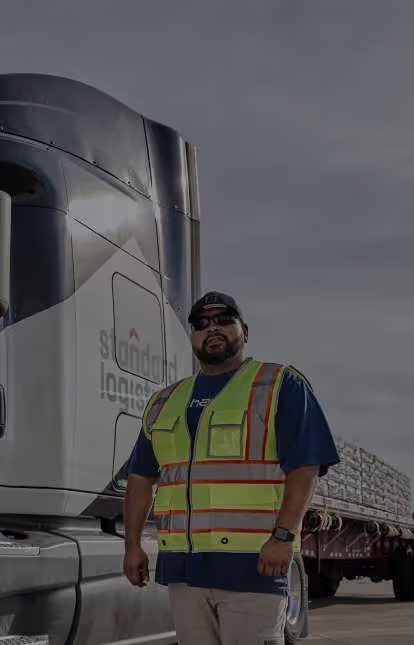 A man standing next to a truck.