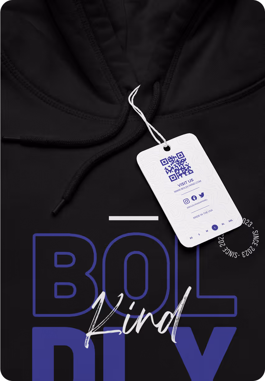 Custom apparel mockup featuring Boldly Kind hoodie and branded QR code hang tag for cohesive merch and print branding.