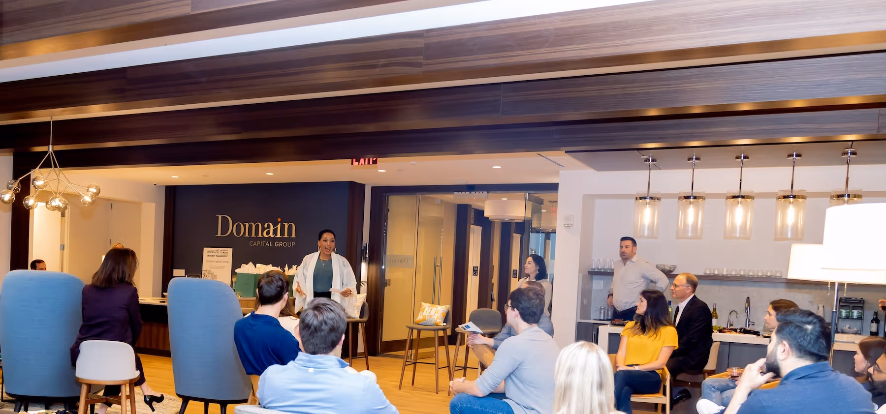 A group of Domain Capital Group employees in the Domain office