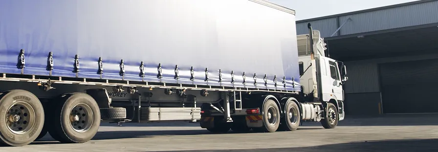 truck sixteen wheeler pulling out from a loading dock