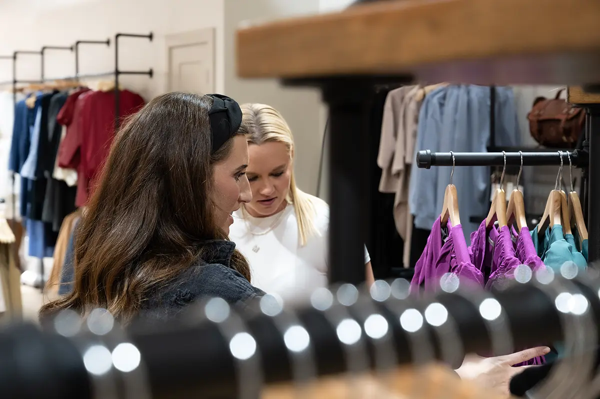 Friends shop at a boutique in downtown Grand Island.