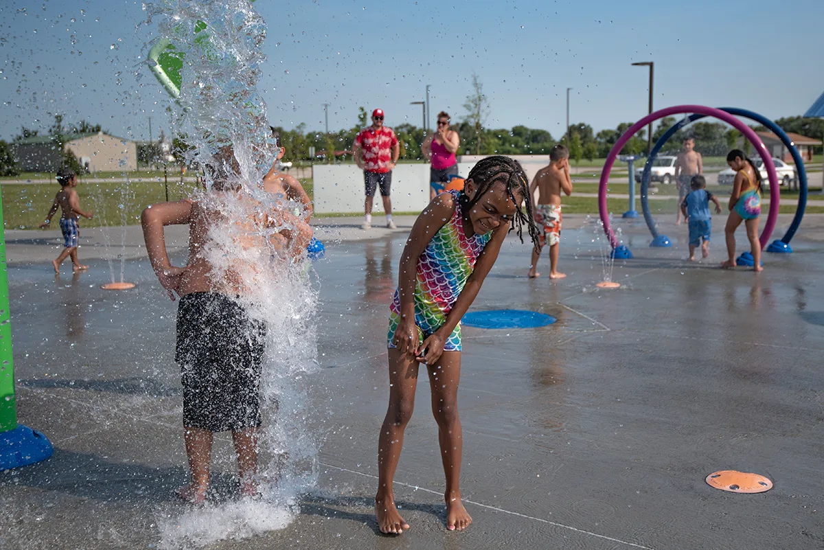 Children play at the Veterans Sports Complex splash pad in Grand Island, Nebraska. 