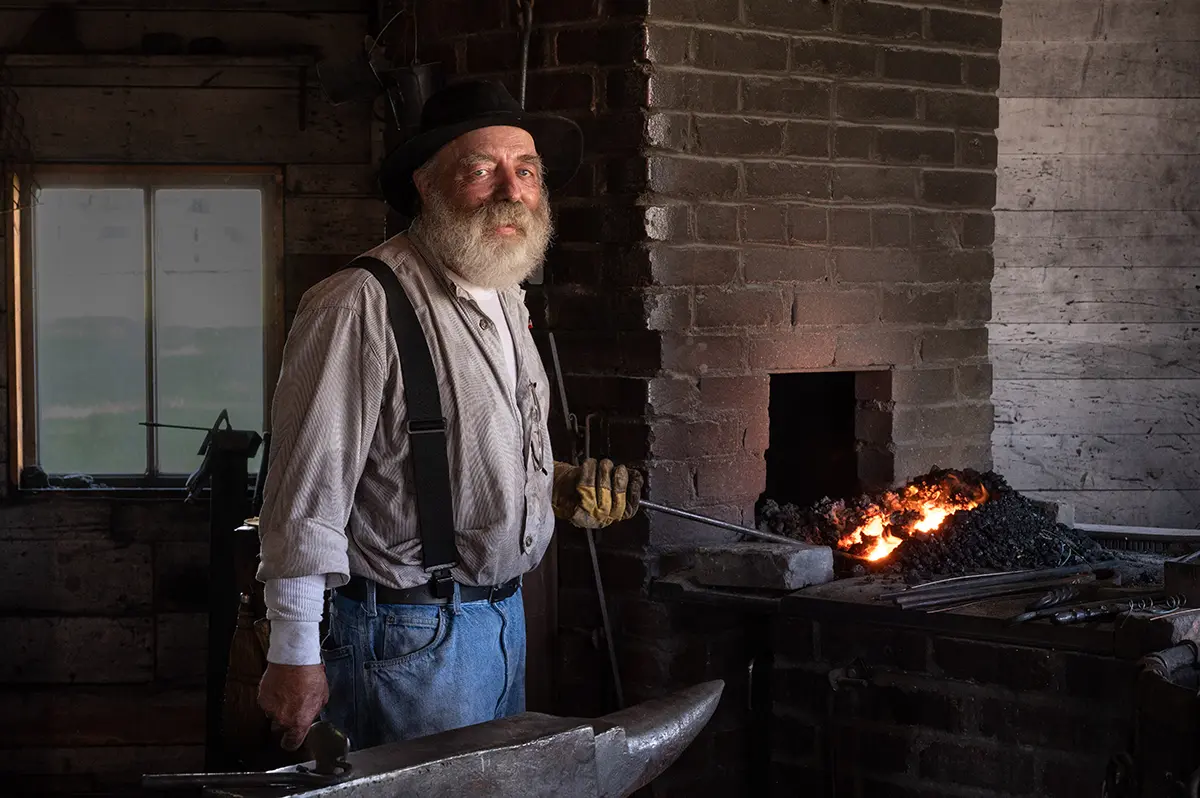 A blacksmith in Stuhr Museum's Railroad Town.