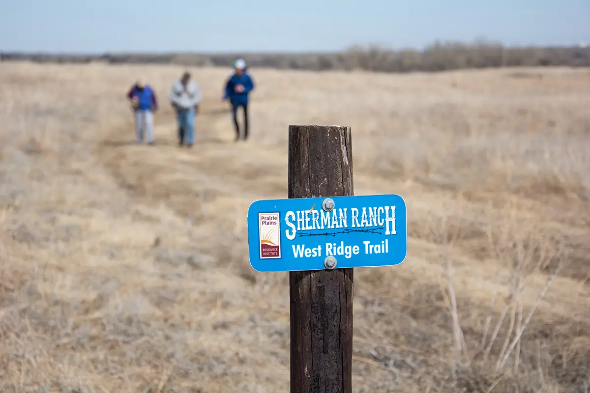 A group of hikers on the West Ridge Trail at Sherman Ranch prairie. 