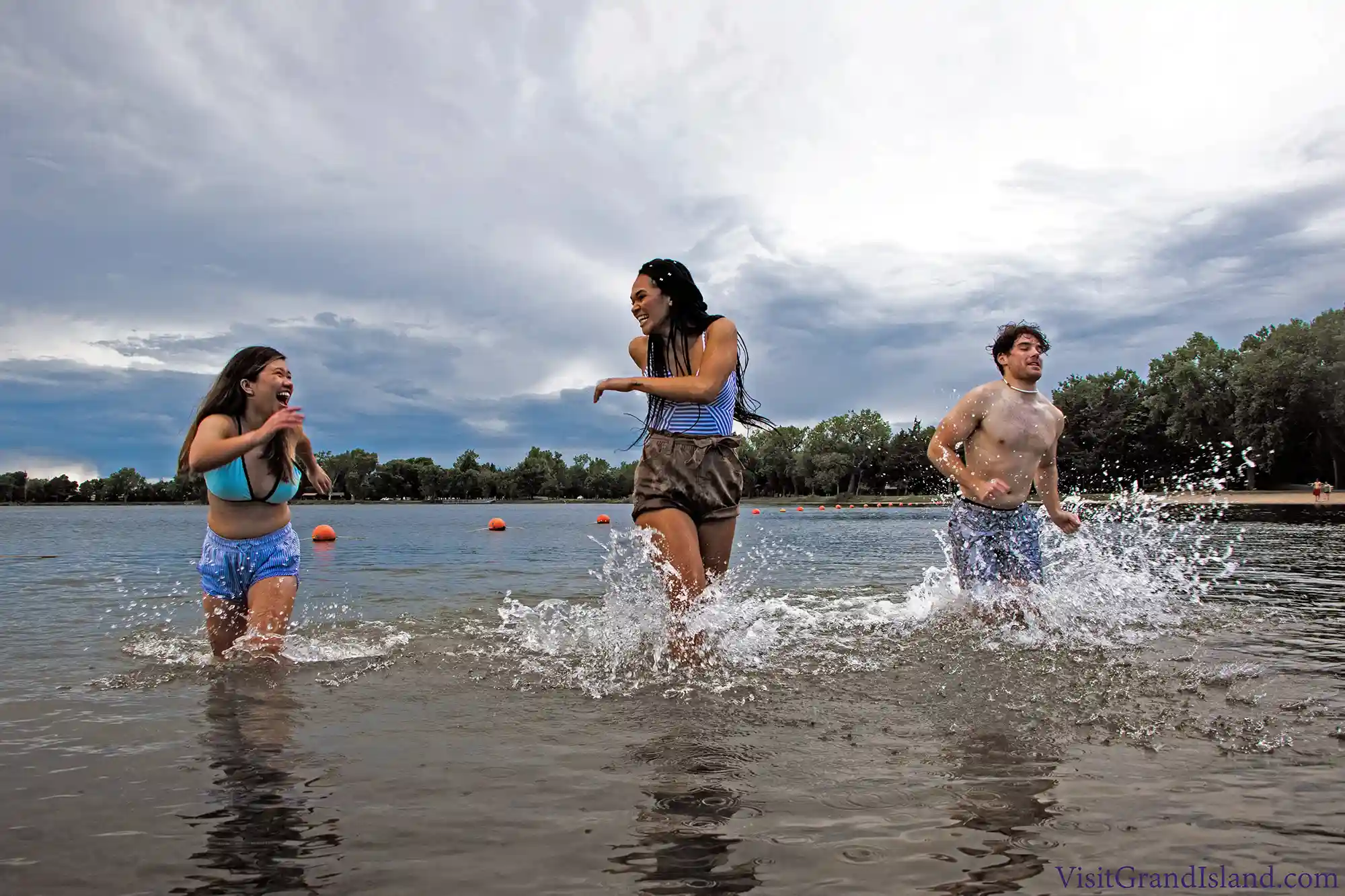 Three college students in the lake at Mormon Island State Recreation Area.
