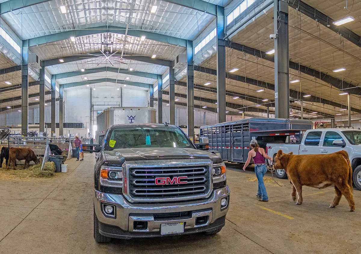 Families unload livestock trailers in the cattle barn on the Fonner Park Campus in Grand Island, Nebraska.