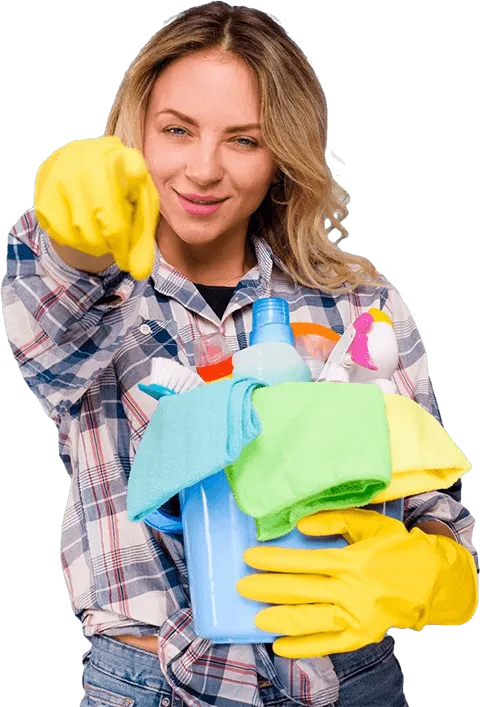 Young beautiful cleaner woman holding bucket with products pointing camera against blue backdrop