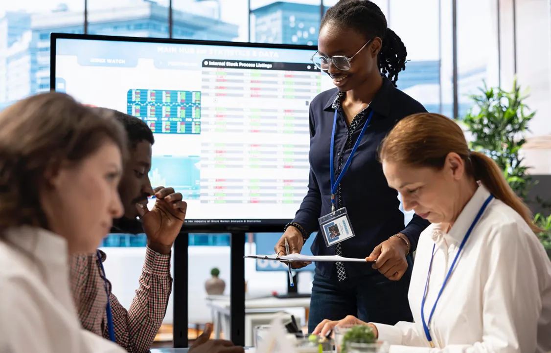 A group of people sitting around a table.