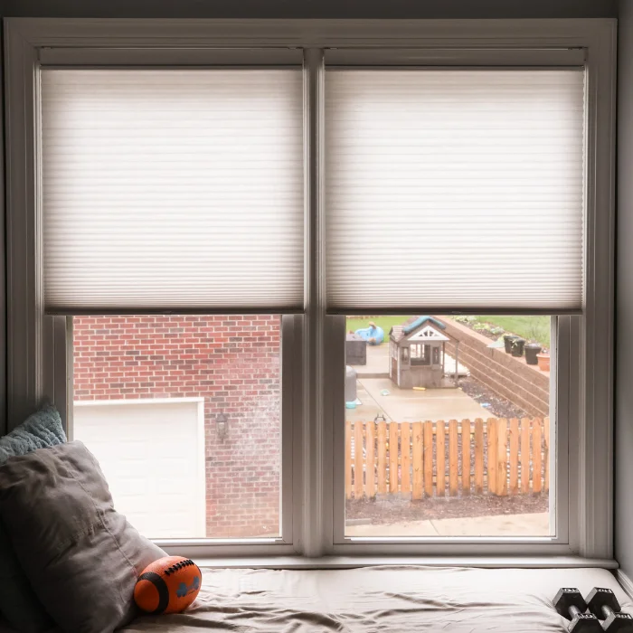 Window seat with half-drawn honeycomb shades