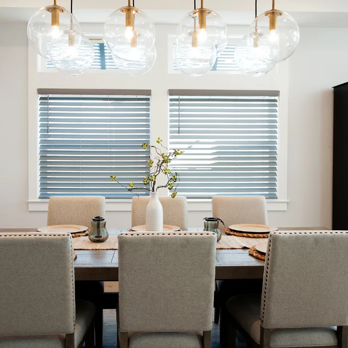Formal dining room with horizontal blinds and soft neutral tones