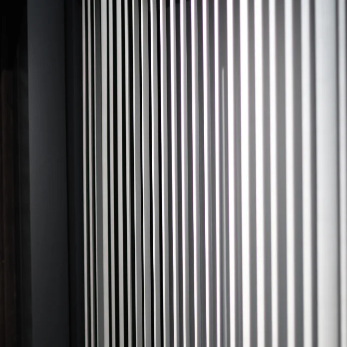 Detail view of partially opened vertical blind slats