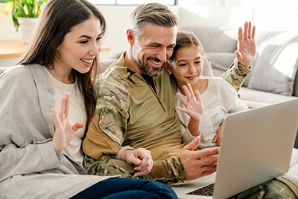 Military family looking at a laptop
