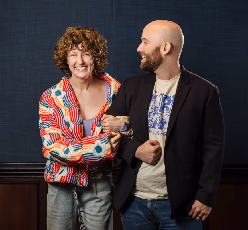 AJ Patterson and Cole Patterson, founders of heyZensei, are standing with each other and laughing at the camera.