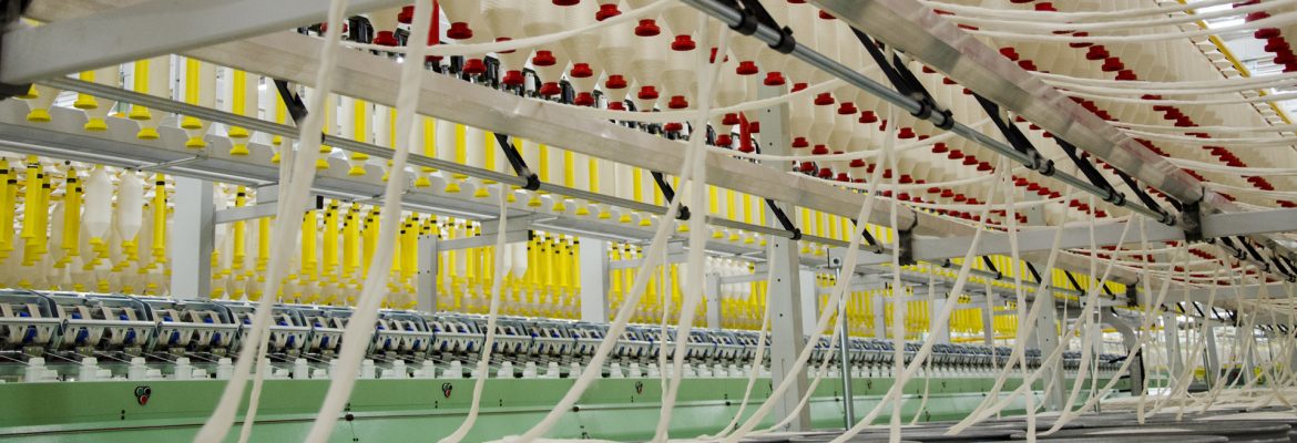 [background image] sunlit tailor shop workspace