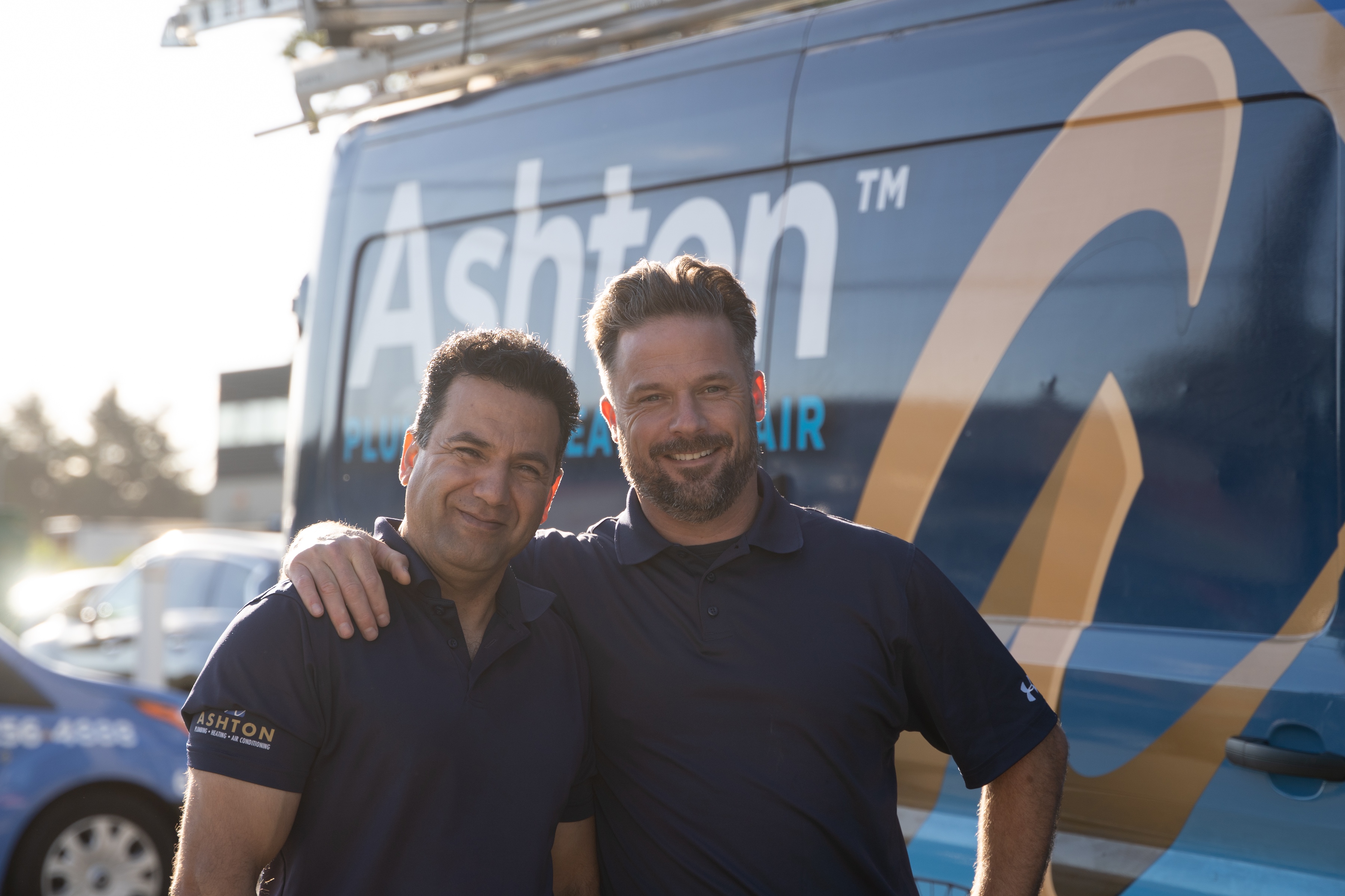 image of plumber fixing a sink