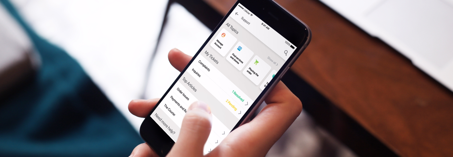Cover mockup of person using mrsool app support home