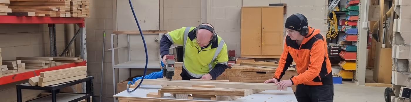 Photo of timberworks department staff cutting timber to size