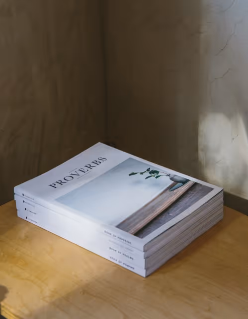 stack of paperback books on a table